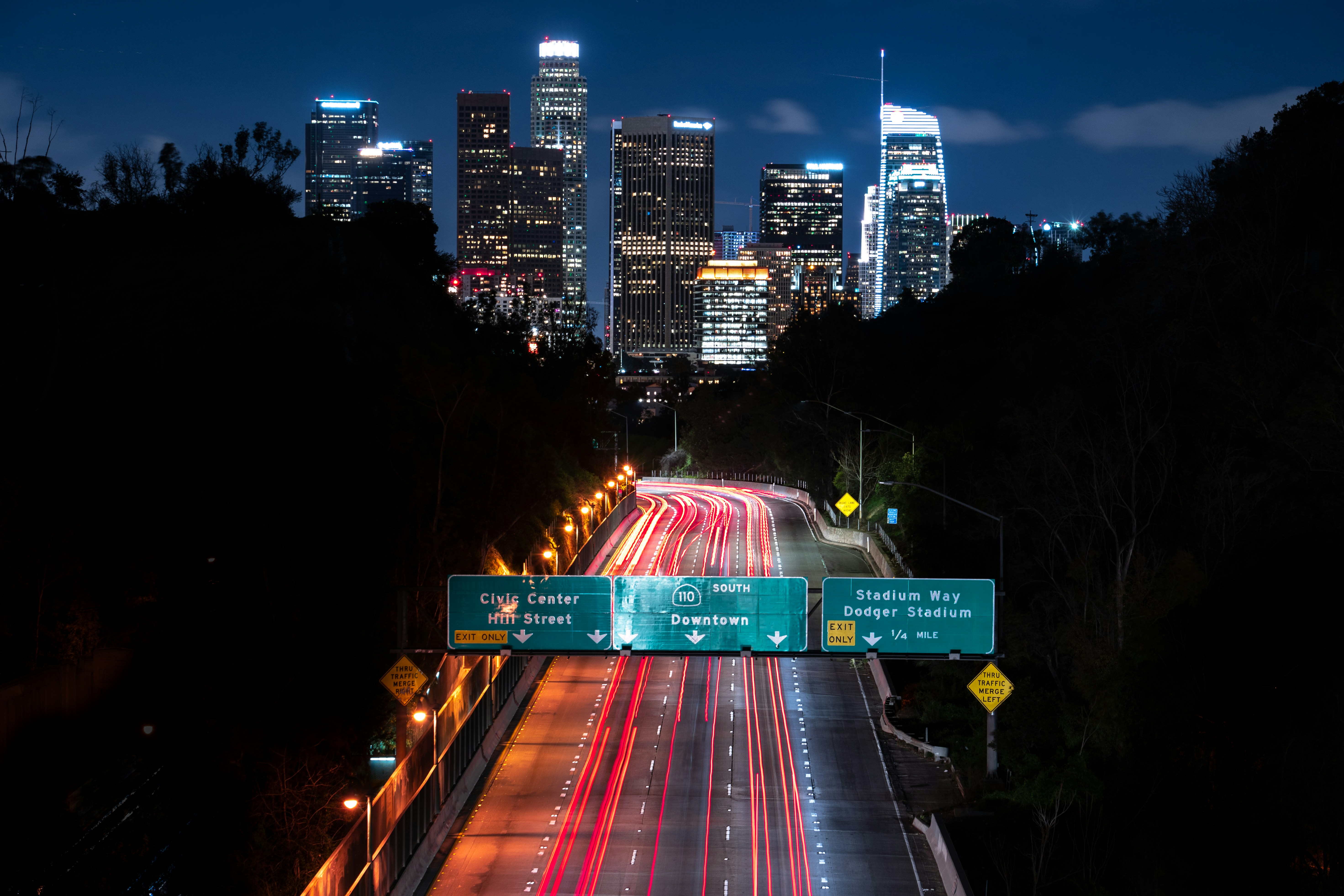 A wide aerial view of bumper-to-bumper traffic on the 405 freeway in Los Angeles